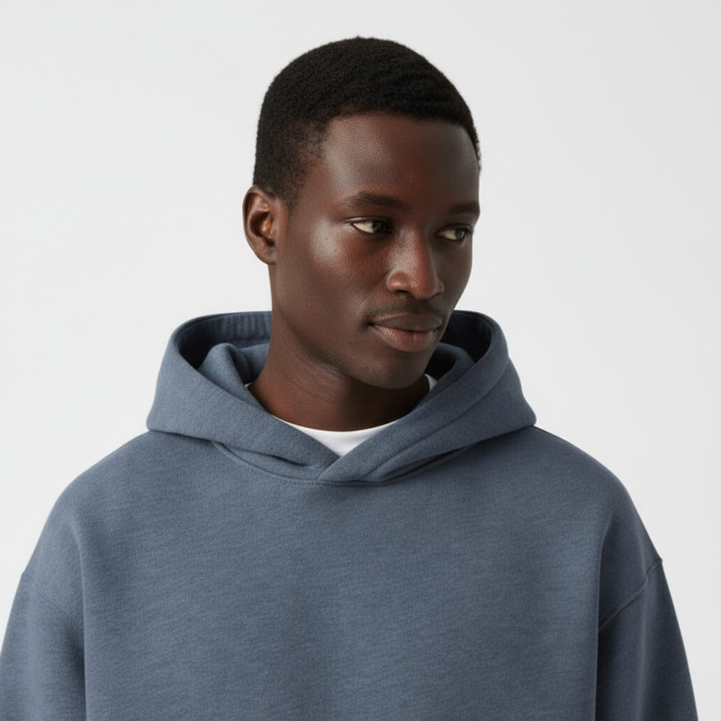 Men's heavyweight hoodie in washed blue, close-up of the hood and the neckline