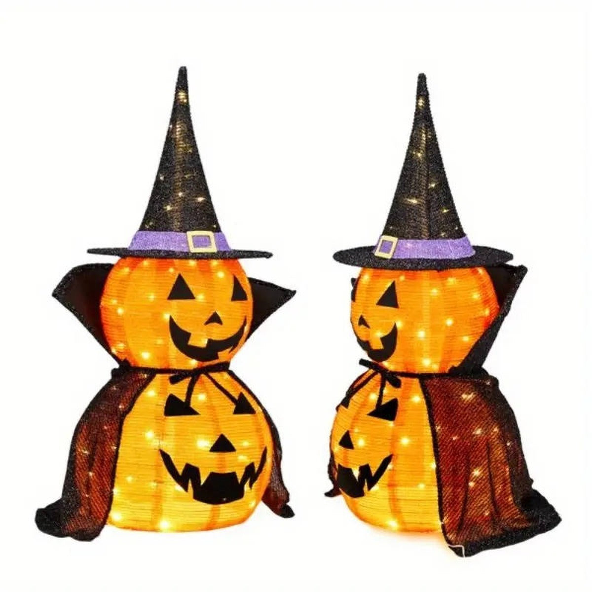 Two lit pumpkins with black capes, side view