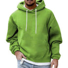 Men's oversized hoodie in light green, worn, front view