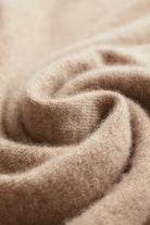 Men's knitted hooded jumper in beige, close-up of the fine knit