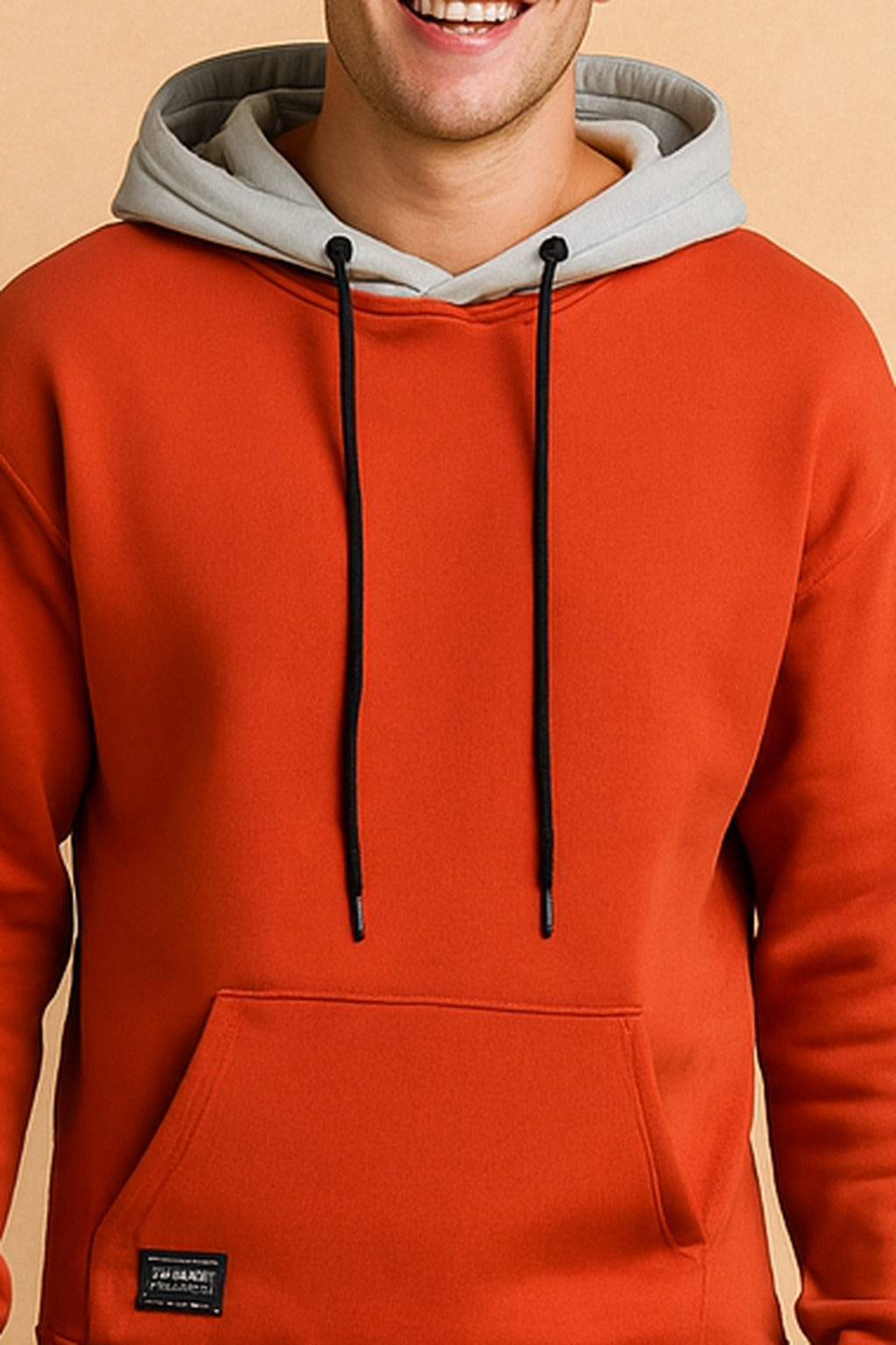 Men's two-tone hoodie with contrast hood in orange, close-up of the contrast hood and drawstrings