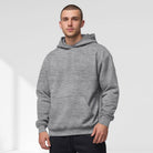 Men's oversized drop-shoulder hoodie in grey, worn, front view