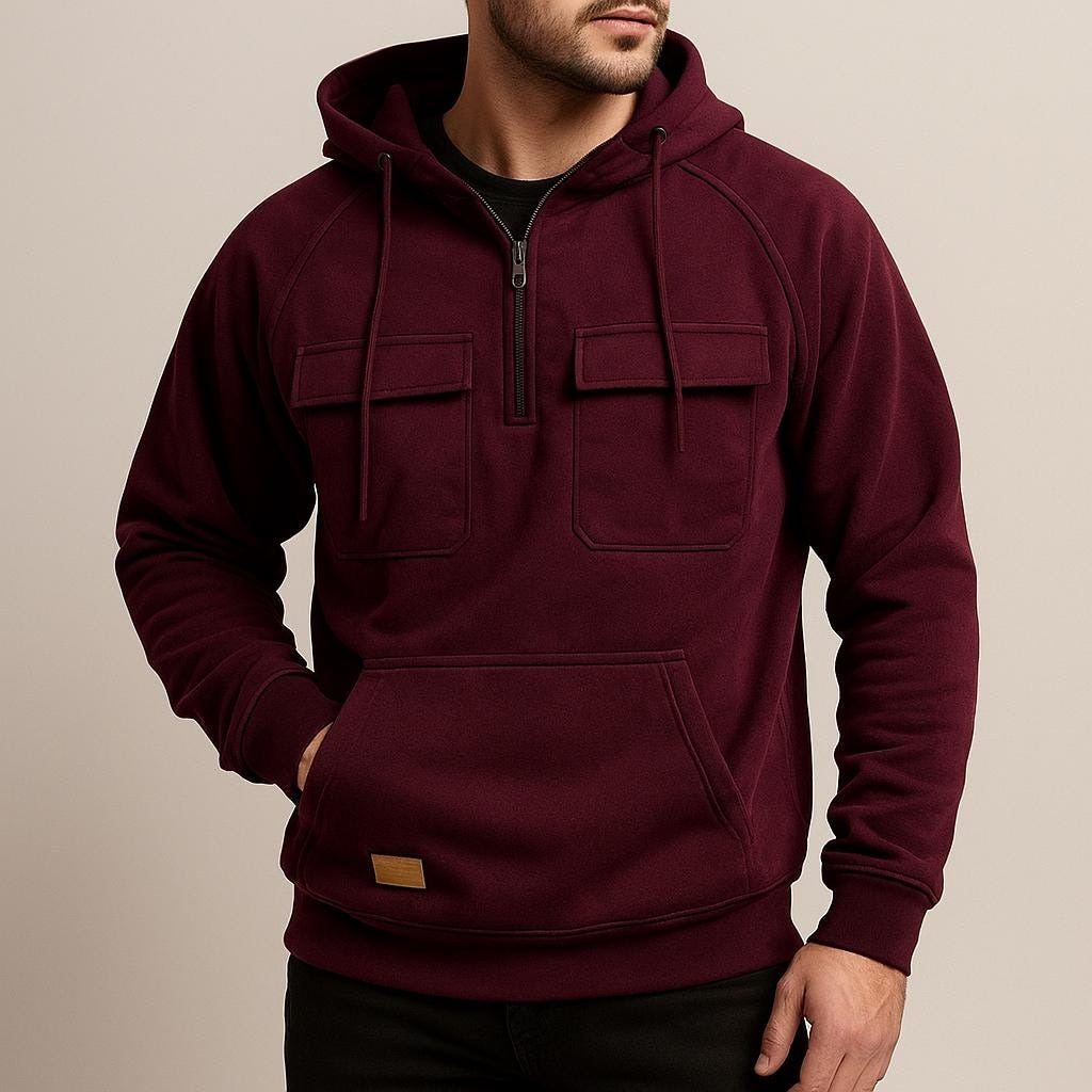 Men's half-zip utility hoodie with chest pockets in wine red, worn, front view