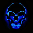 Blue LED skull mask glowing in the dark