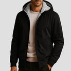 Men's sherpa-lined zip hoodie in black, worn, front view