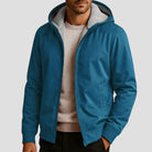 Men's sherpa-lined zip hoodie in petrol blue, worn, front view