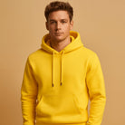 Men's classic drawstring hoodie in yellow, worn, front view