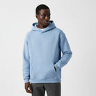 Men's heavyweight hoodie in light blue, worn, front view