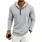 Men's textured quarter-zip hoodie in light grey, worn, front view