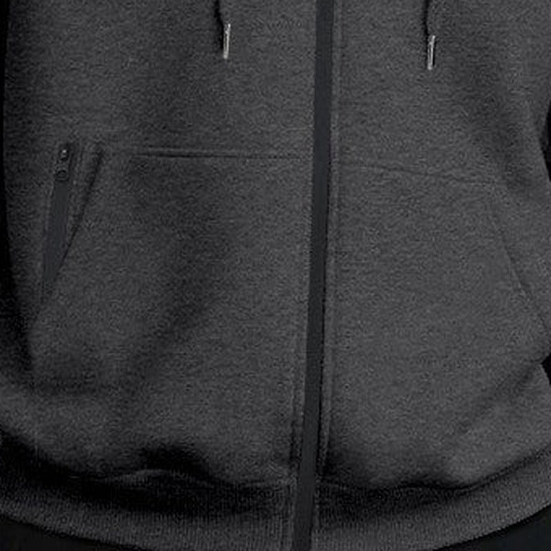 Men's oversized zip-up hoodie in dark grey, close-up of the kangaroo pocket and the zip
