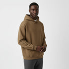 Men's heavyweight hoodie in brown, worn, front view