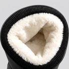 Close-up of the white fleece lining inside the ribbed knit cuff.