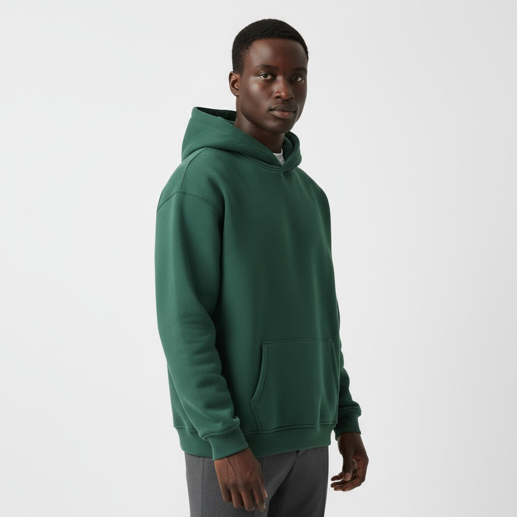 Men's heavyweight hoodie in deep green, worn, front view