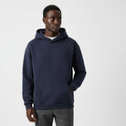 Men's heavyweight hoodie in navy, worn, front view