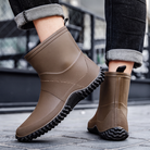 Brown rubber ankle boots for men, worn with jeans