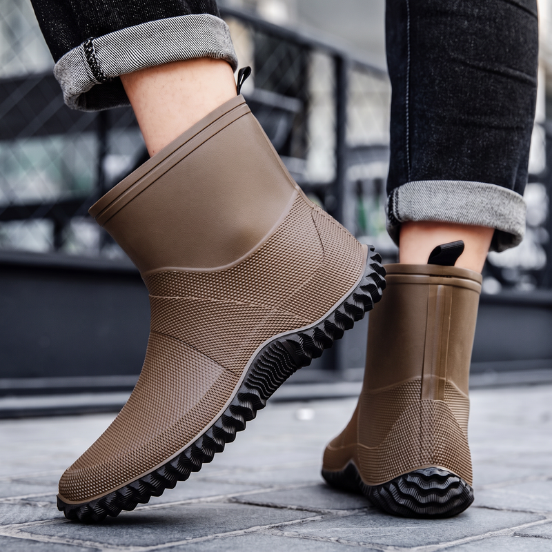 Brown rubber ankle boots for men, worn with jeans