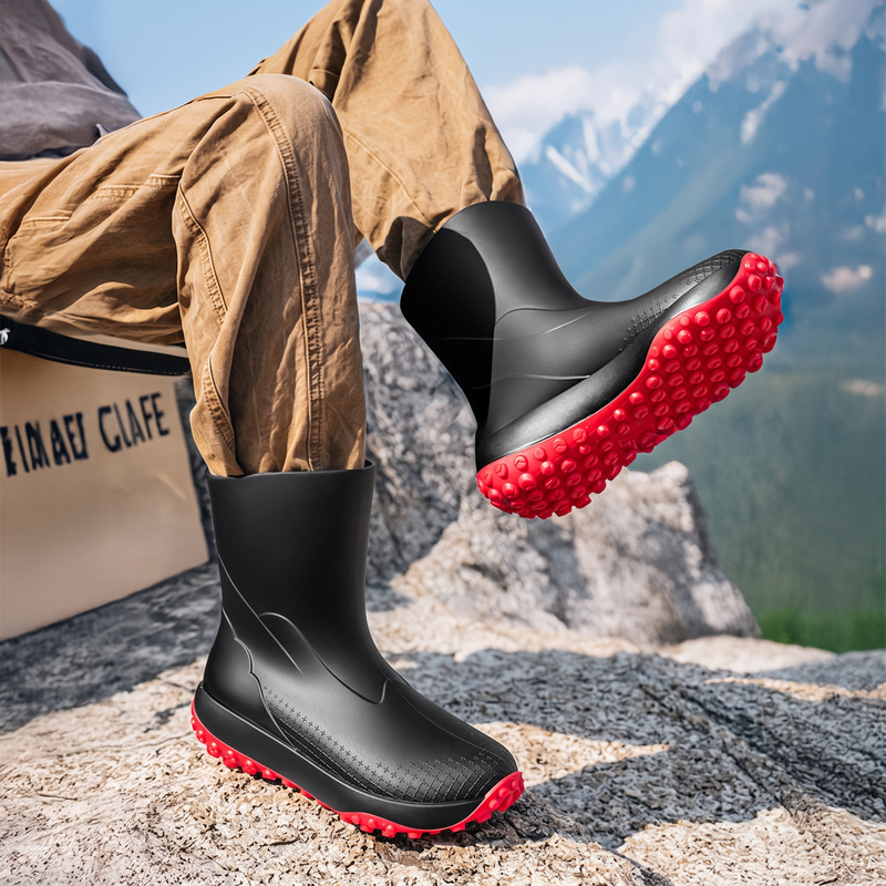 Black men's wellies with red non-slip sole, worn