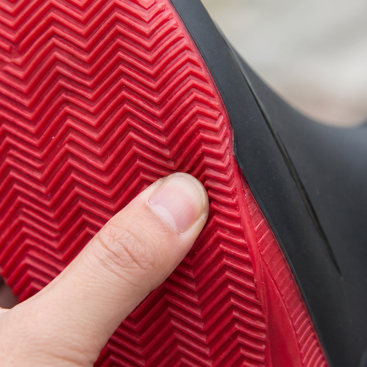 Close-up of the red sole with herringbone tread