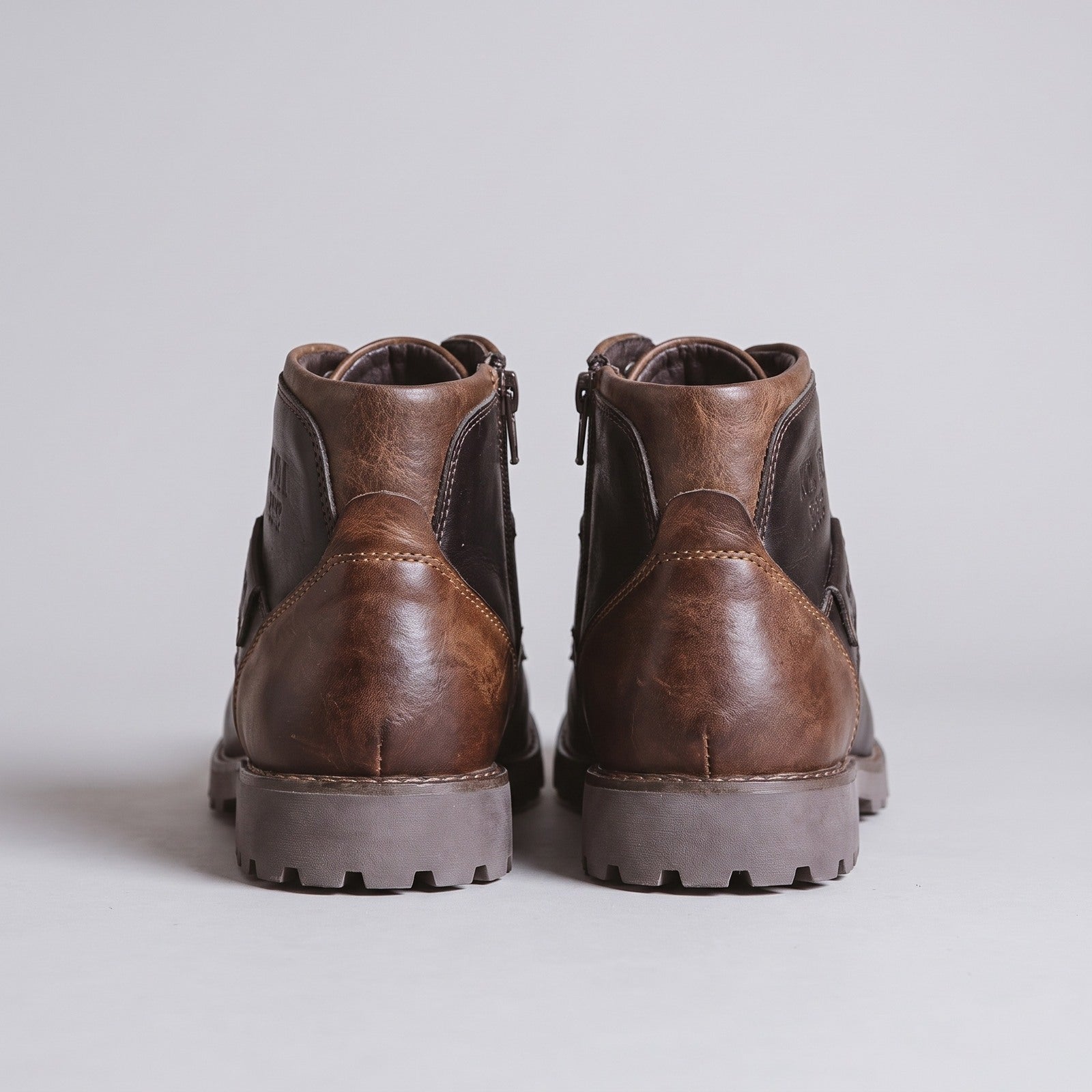 Rear view of brown lace-up ankle boots with lug soles | Chaps London