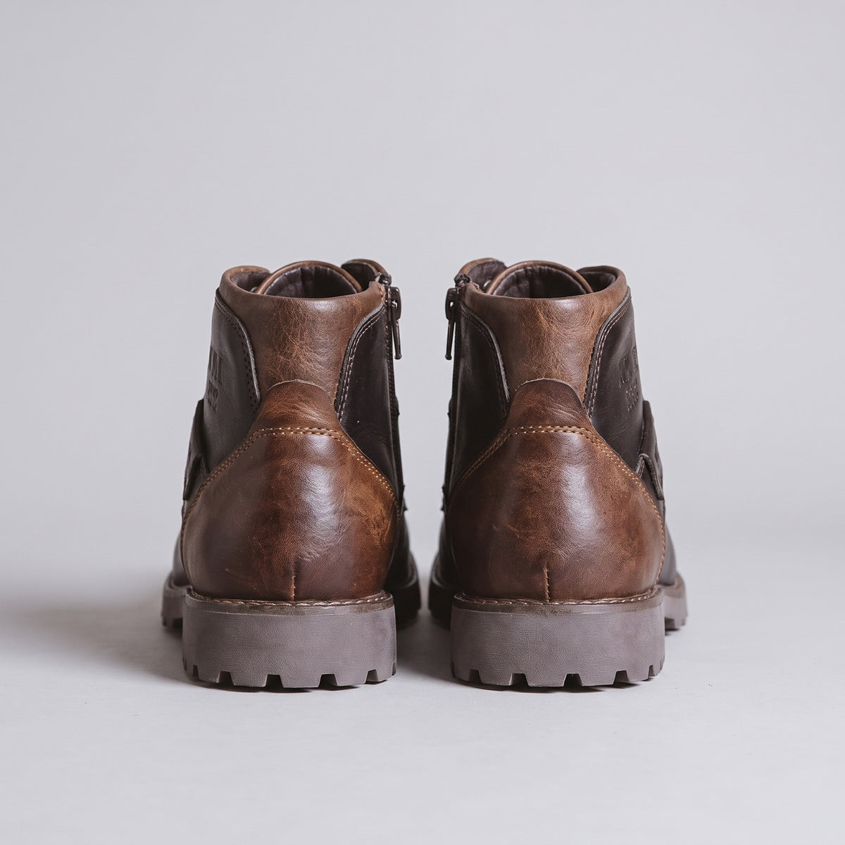 Rear view of brown lace-up ankle boots with lug soles | Chaps London