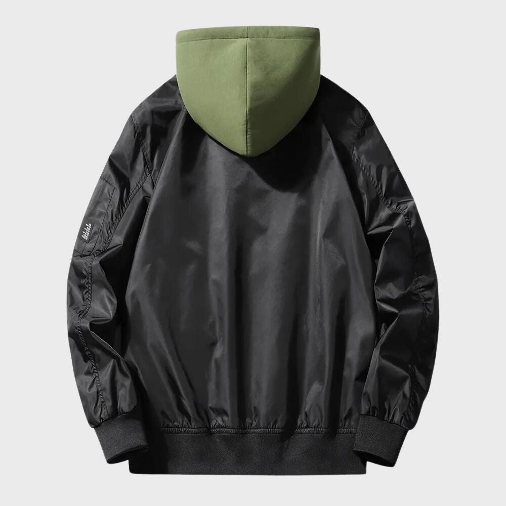 Black bomber jacket with green hood, back view, worn by person | Chaps London