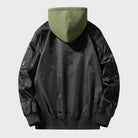 Black bomber jacket with green hood, back view, worn by person | Chaps London
