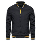 Black bomber jacket with yellow-striped trim, worn by male model | Chaps London