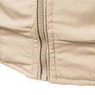Beige fabric close-up showing zipper detail and stitched seams flat | Chaps London