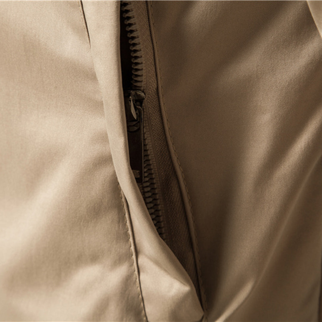 Close-up of beige jacket zipper pocket, fabric texture visible, no person shown | Chaps London