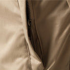 Close-up of beige jacket zipper pocket, fabric texture visible, no person shown | Chaps London