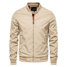 Beige bomber jacket with striped trim, worn by man, front view | Chaps London
