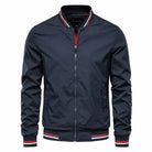 Navy blue bomber jacket with red white striped trim, worn by model | Chaps London