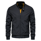 Black zip-up bomber jacket with yellow lining, worn by man, front view | Chaps London