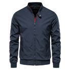 Navy blue zip-up bomber jacket with red trim, worn by man | Chaps London
