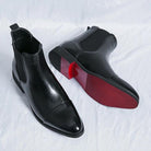 Black faux leather Chelsea boots with elastic side panel, red sole, pair shown | Chaps London