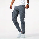Man wearing gray denim cargo pants with side pockets, white sneakers | Chaps London