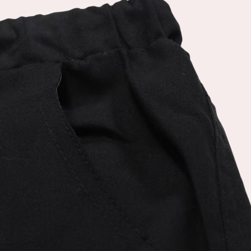 Black cargo joggers close-up showing elastic waistband and side pocket detail | Chaps London