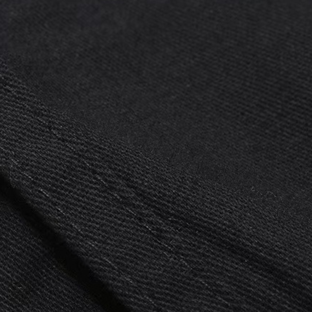 Close-up of black twill fabric with visible seam and diagonal weave texture | Chaps London