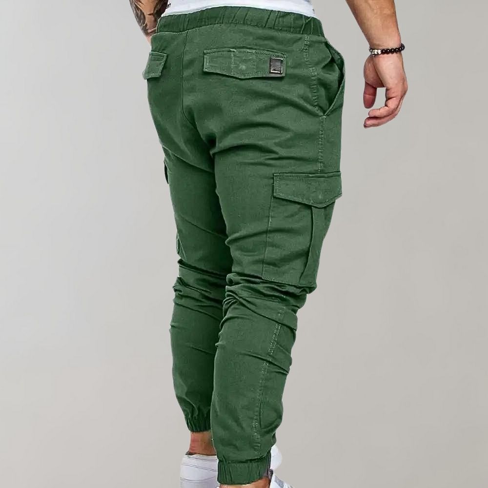 Man wearing green cargo joggers with side pocket, rear view, worn | Chaps London