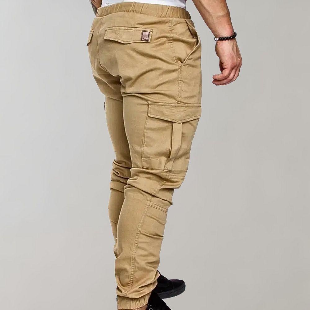 Man wearing khaki cargo joggers with side pockets, tapered ankle cuffs | Chaps London