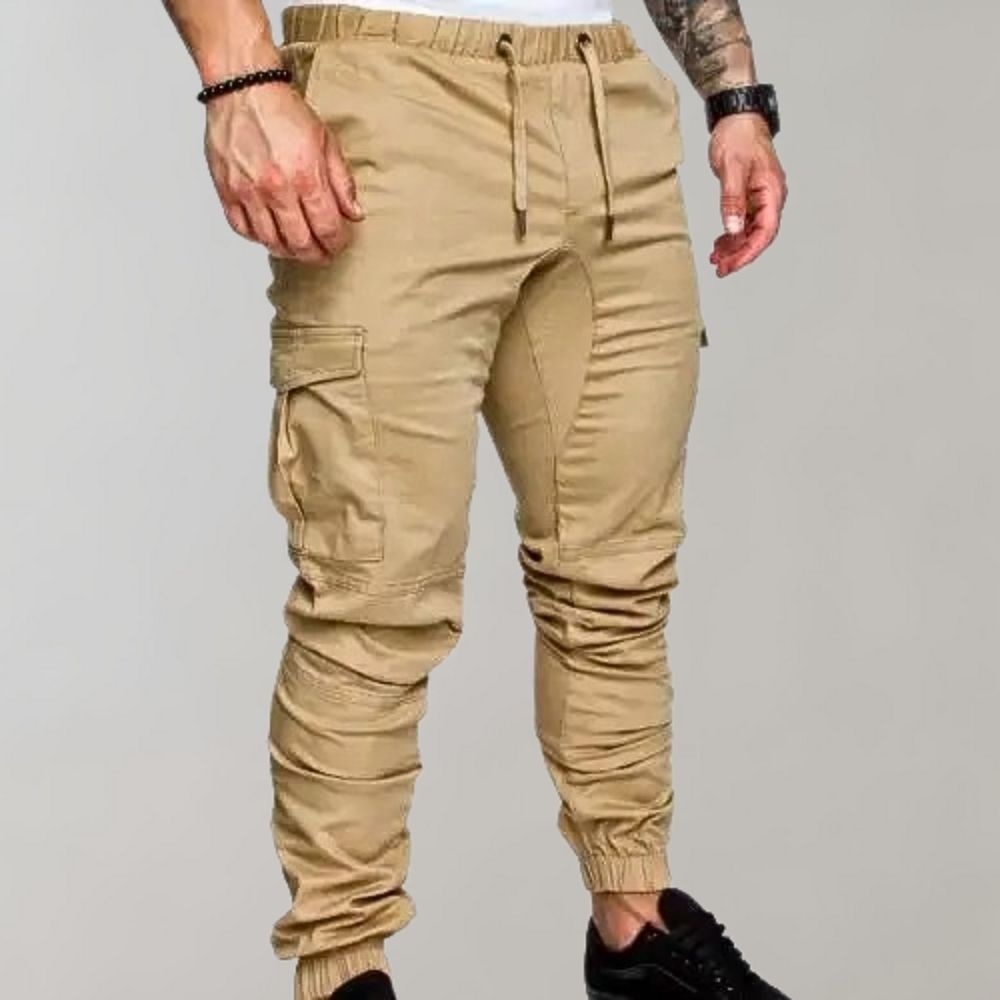 Beige cargo joggers with drawstring waist worn by man, side view | Chaps London