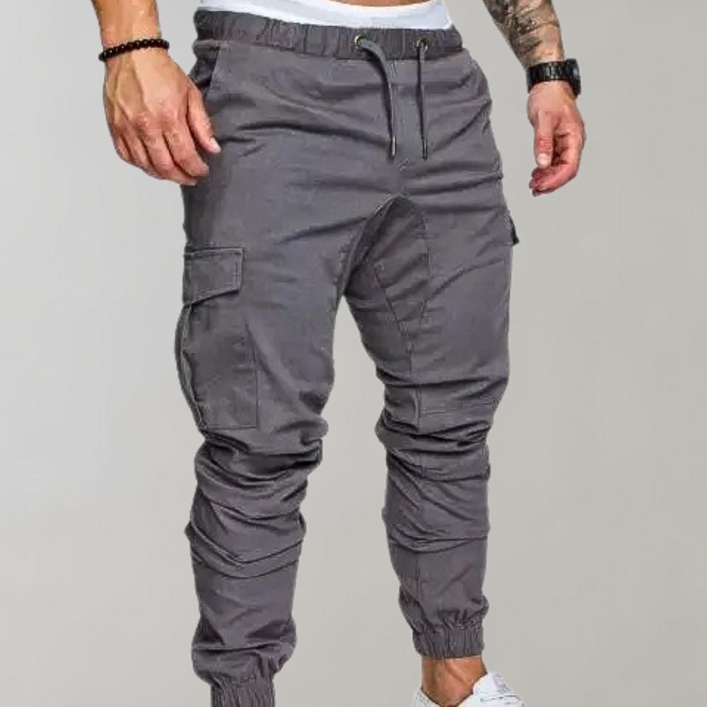 Man wearing gray cargo joggers with drawstring waist and side pocket | Chaps London