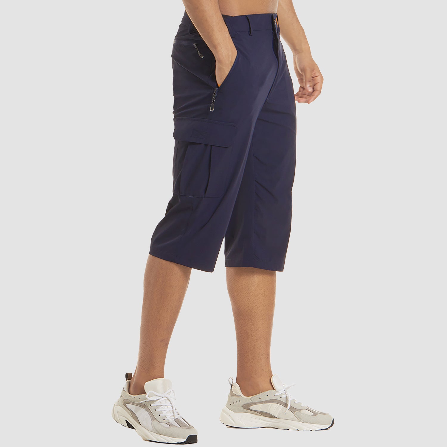 Man wearing navy blue cargo shorts with side pockets and white sneakers | Chaps London