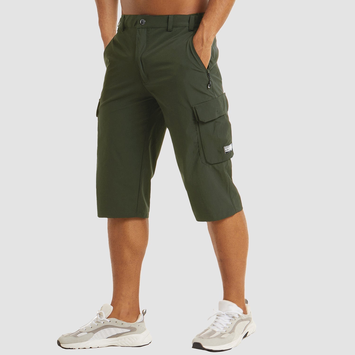 Man wearing olive green cargo shorts with multiple pockets, worn casually | Chaps London
