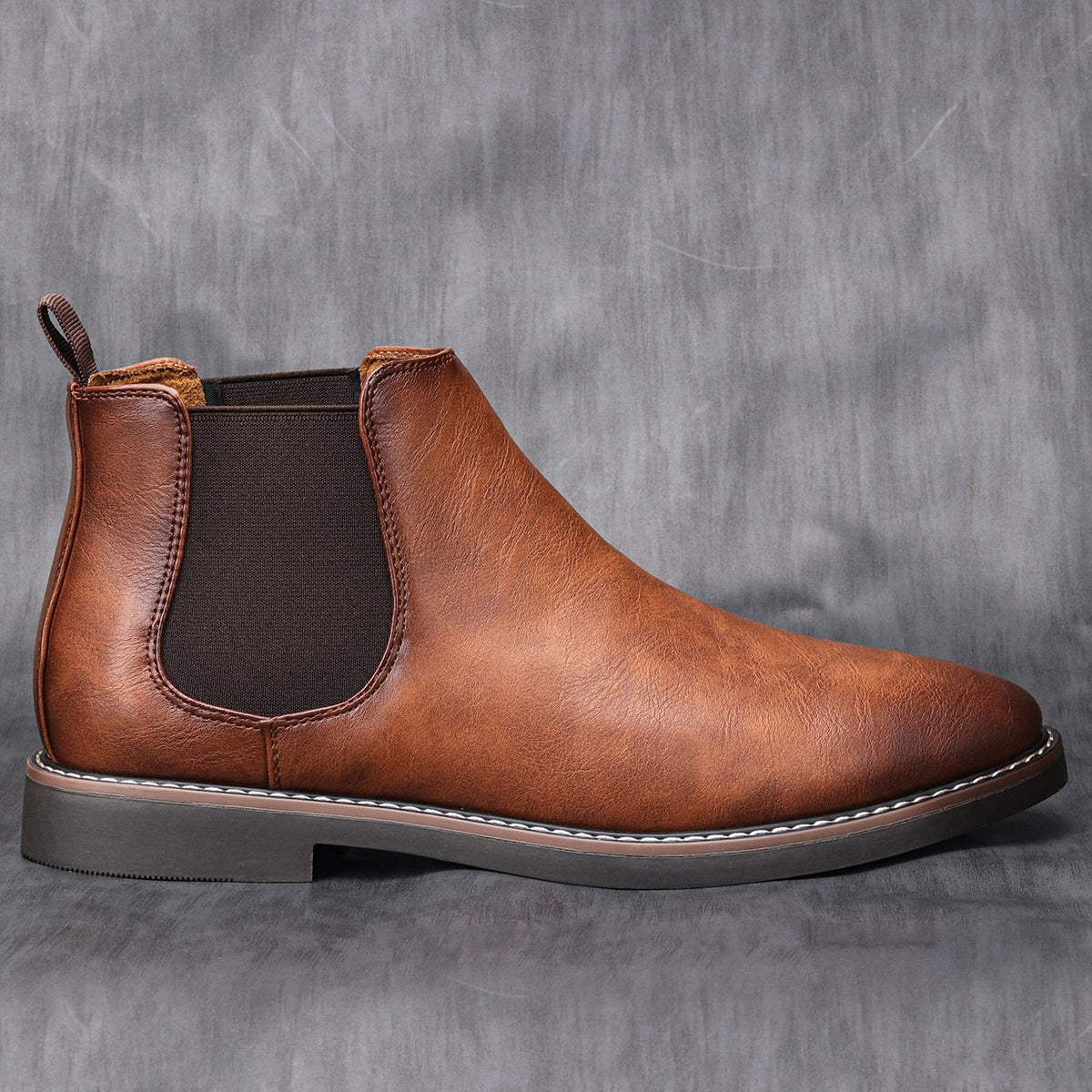Brown leather Chelsea boot with elastic side panel, shown standing alone | Chaps London