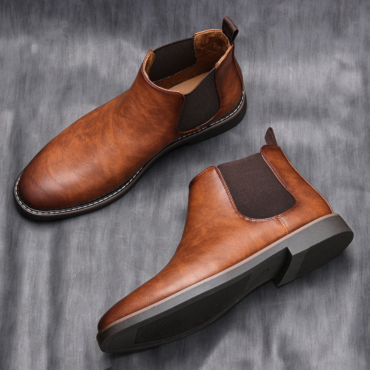 Brown leather Chelsea ankle boots with elastic side panels, flat lay display | Chaps London