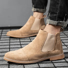 Beige faux suede Chelsea ankle boots worn by a person outdoors | Chaps London