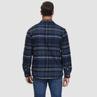 Man wearing navy blue plaid flannel overshirt jacket, back view, jeans | Chaps London