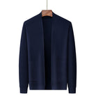 Navy blue knitted open-front cardigan with textured pattern, hanging on wooden hanger | Chaps London