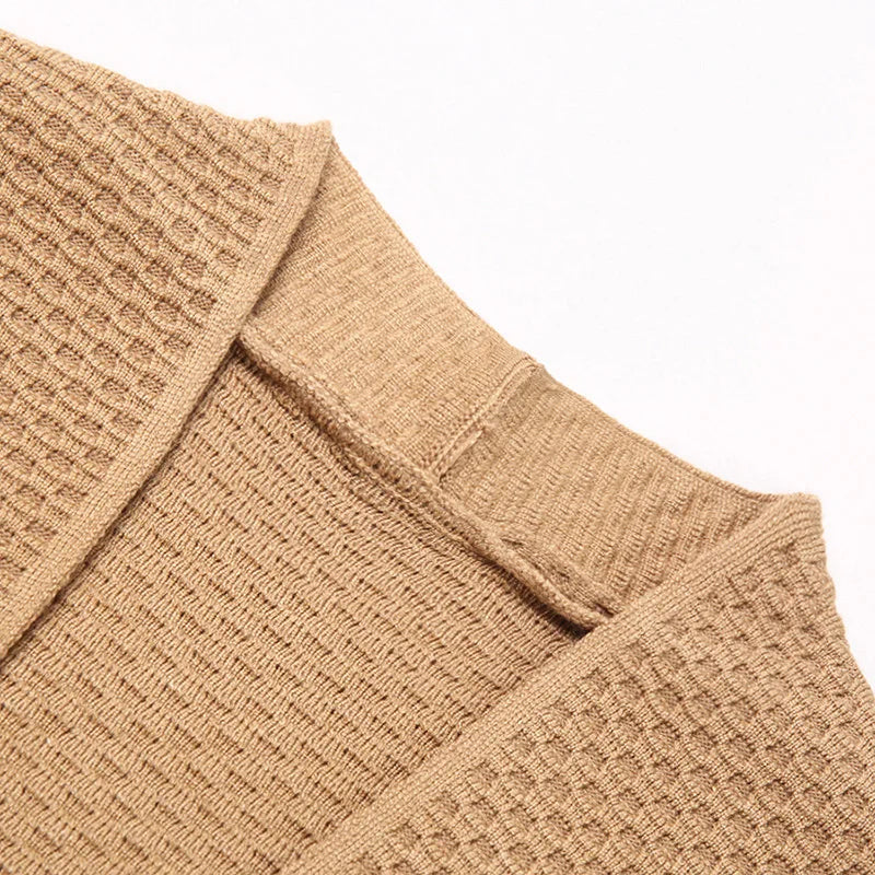 Close-up of tan knitted cardigan collar and shoulder seam, flat lay | Chaps London